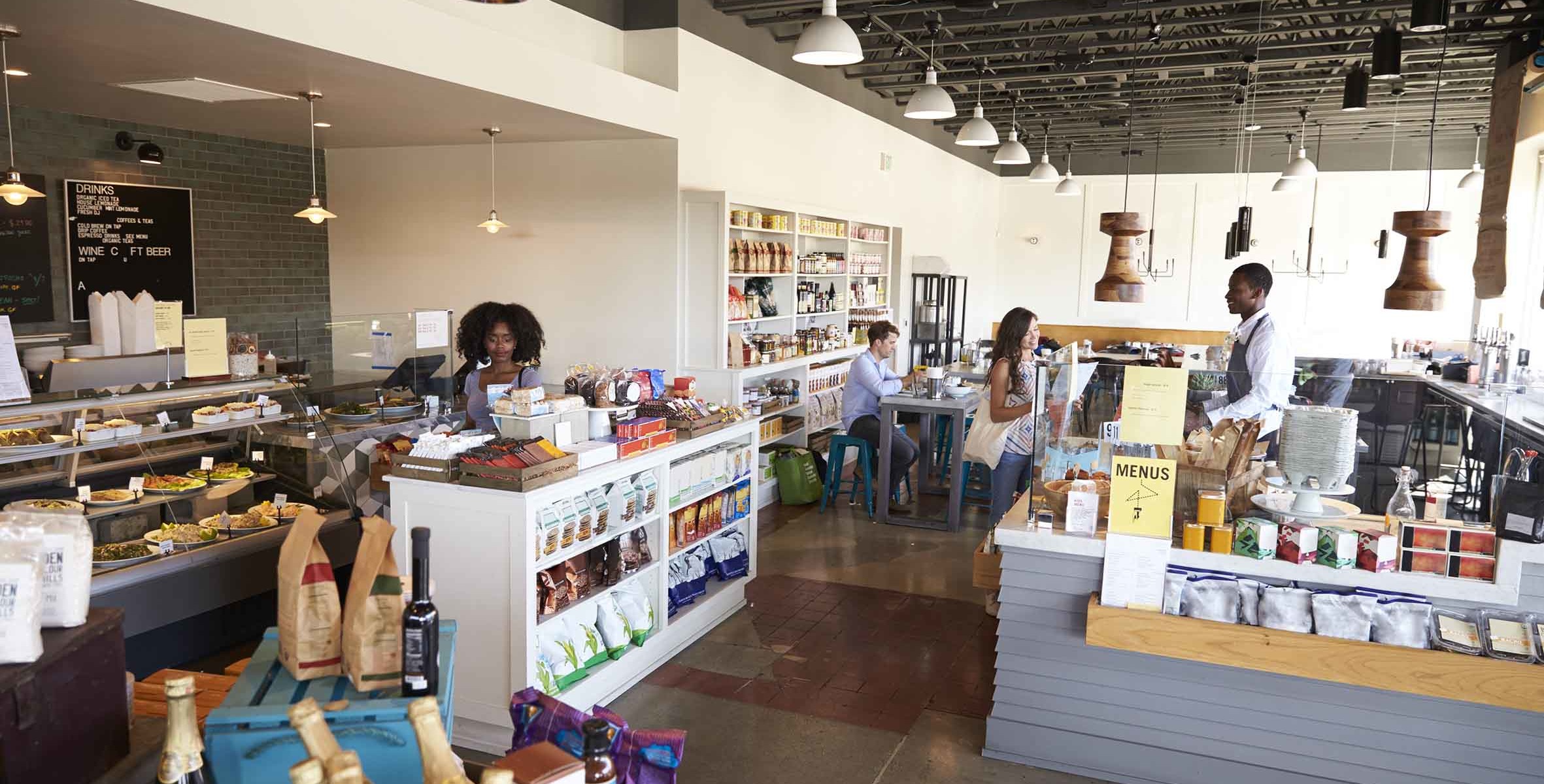 Interior Of Busy Delicatessen With Customers